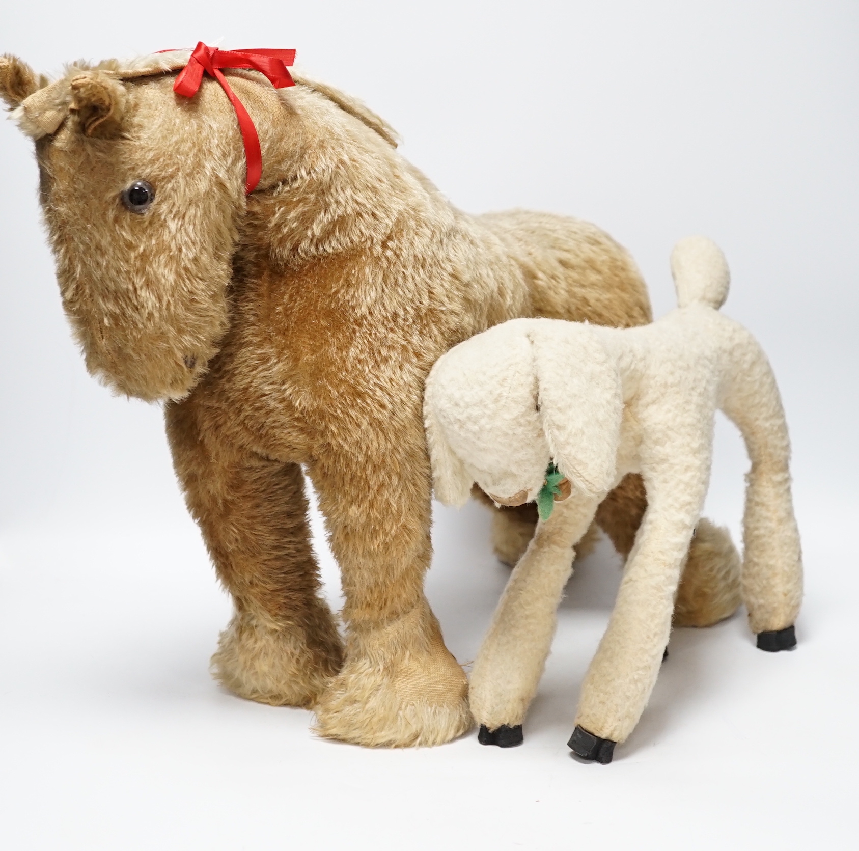 A Chiltern cart horse with label, c.1950s, height to shoulder 38cm, some hair loss and a Deans Rag book lamb with Dean's label 1950's, height 23cm, some hair loss